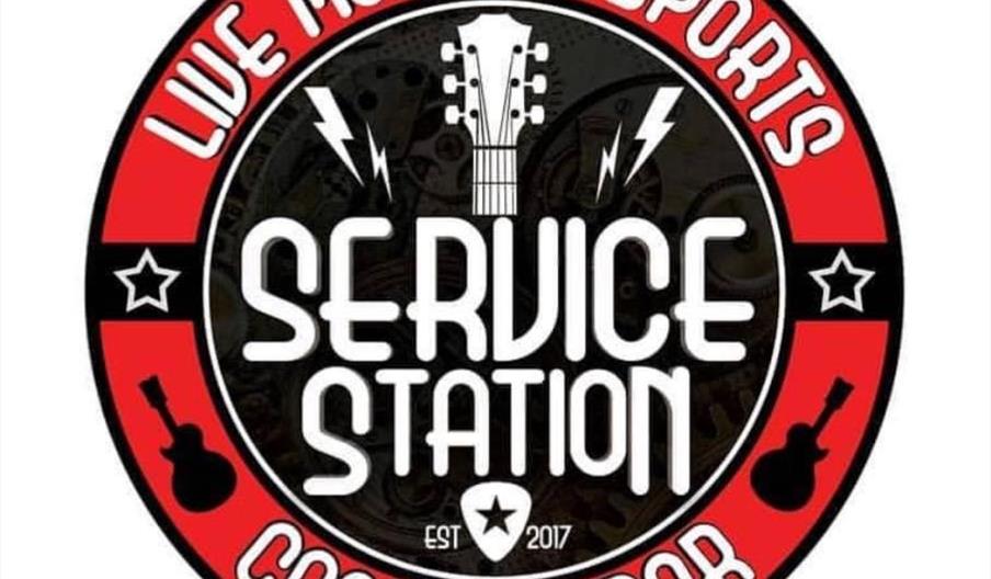 Circular logo for "Service Station" featuring a guitar headstock, lightning bolts, and the text "Live Music & Sports Cocktail Bar" in red and white, w