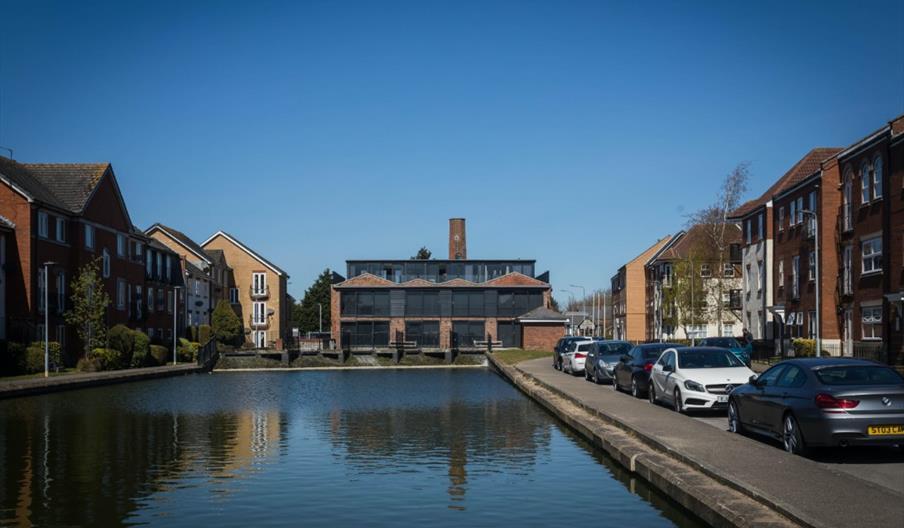 View Of the building, looking over pond.