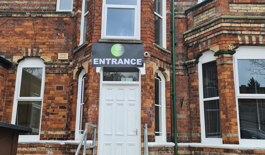 Main outside entrance with metal steps.