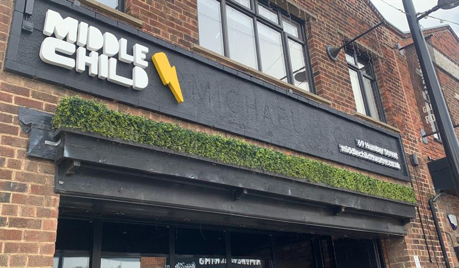 Exterior of Middle Child Theatre in Hull with bold signage on a brick building.