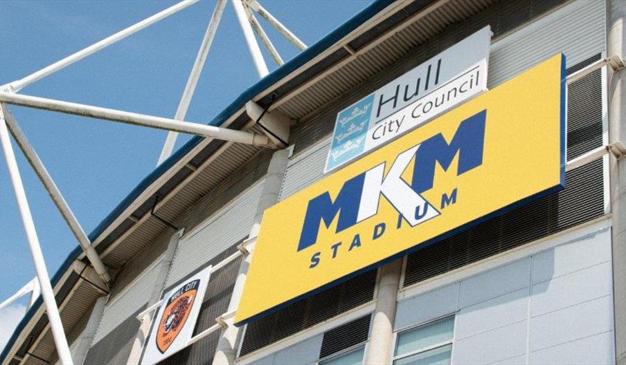 MKM Stadium in Hull, home of Hull City Football Club, with modern exterior and pitch.