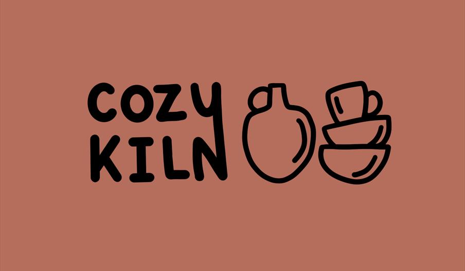 A cartoon drawing of a cup, bowls and a jug, and black text reading 'Cozy Kiln'.