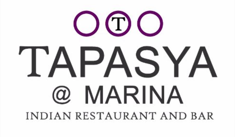 Logo for "Tapasya @ Marina Indian Restaurant and Bar" featuring the restaurant name in bold letters, three purple circles above with a "T" in the cent