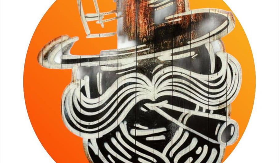 A stylized graffiti mural of a man's face with a large mustache, thick beard, and top hat, smoking a cigar, painted in white, black and orange.