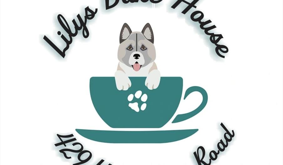 Logo for "Lilys Bake House" featuring an illustrated dog with its front paws resting on the edge of a teal teacup, which sits on a matching saucer wit