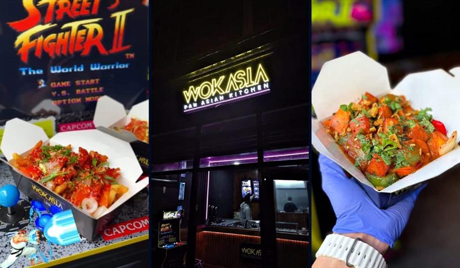 Two blue Wok and Go branded takeout boxes filled with stir fry and noodles on a wooden table.