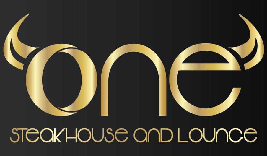 A large, grilled tomahawk steak on a wooden cutting board, garnished with roasted cherry tomatoes and red peppercorns, with a side dish of roasted pot