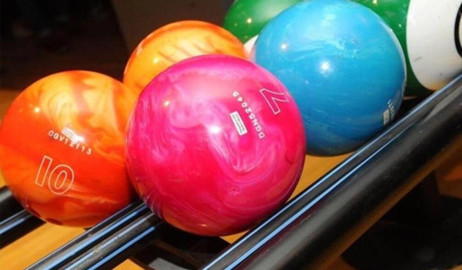 A series of multicoloured bowling balls.