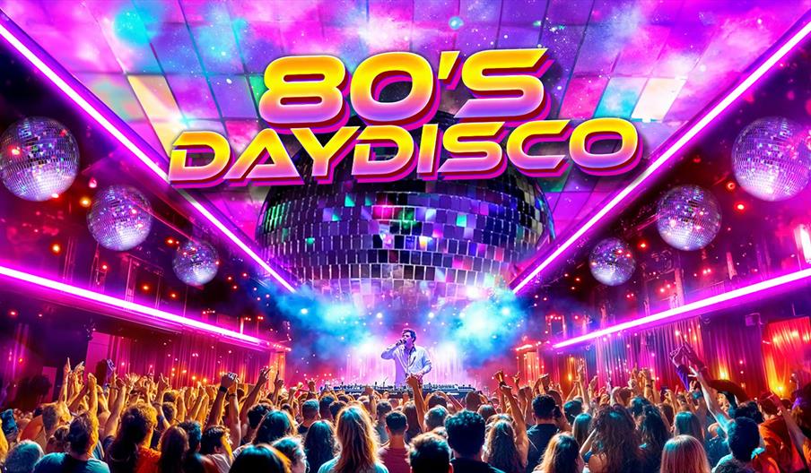 A vibrant disco scene with a crowd dancing under large mirrored disco balls and colorful pink and purple neon lights, with a DJ or performer on stage