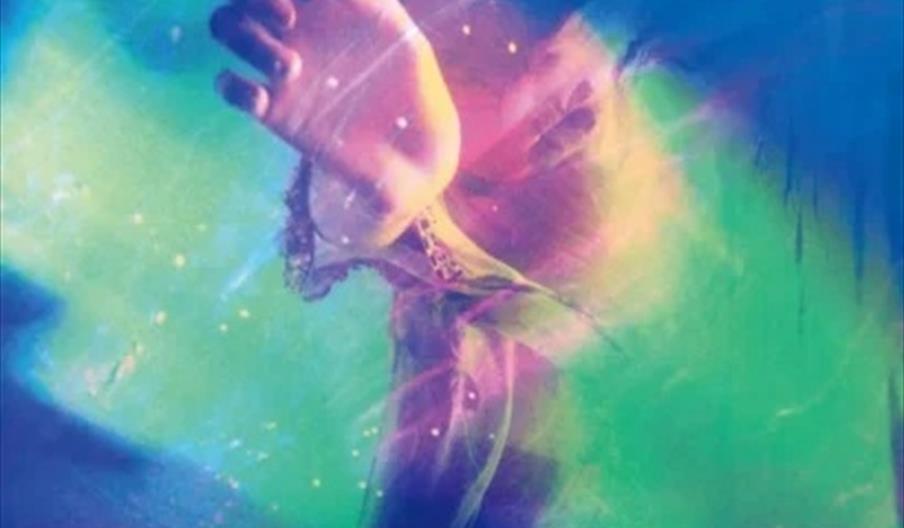 Abstract, colourful digital artwork featuring an outstretched hand in the centre, with swirling shades of blue, green, purple, and pink surrounding it