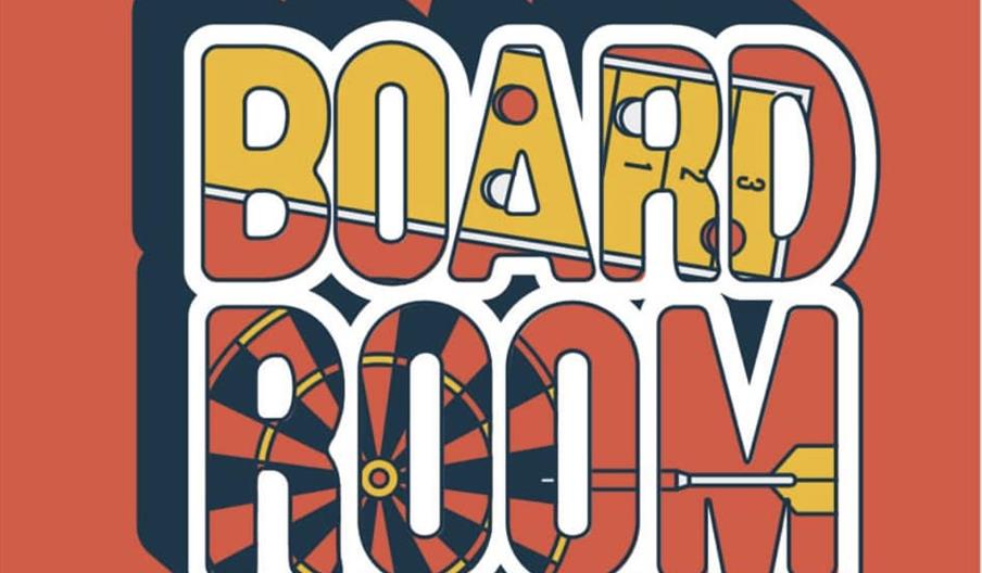Logo with the words "The Board Room at Taphouse" in bold, stylized letters, featuring illustrations of board game pieces, a dartboard, and a dart inte