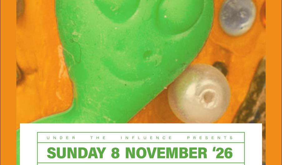 Event poster with a colorful background featuring a green, smiling alien face and round gem-like shapes. Large text at the top reads "congratulations,