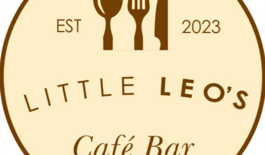 Circular logo for "Little Leo's Café Bar" with a spoon, fork, and knife illustration at the top, "EST 2023" on either side, and the café name in bold