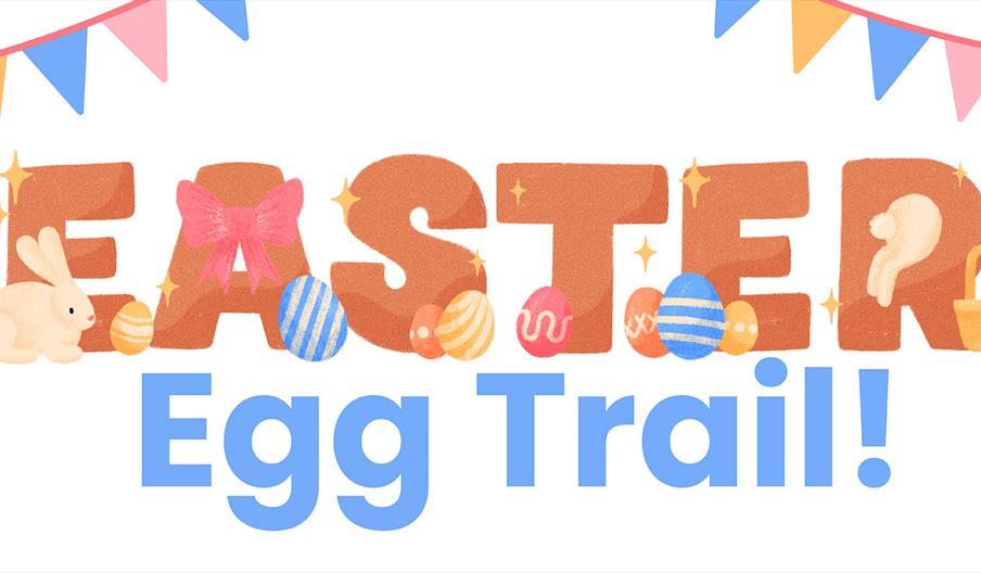 Colourful illustrated text reads "Easter Egg Trail!" with the word "Easter" decorated with a bunny, eggs, a pink bow, sparkles, and a basket, under a