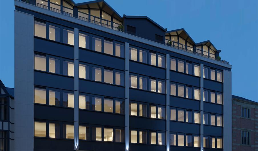 Main building, lit up at night