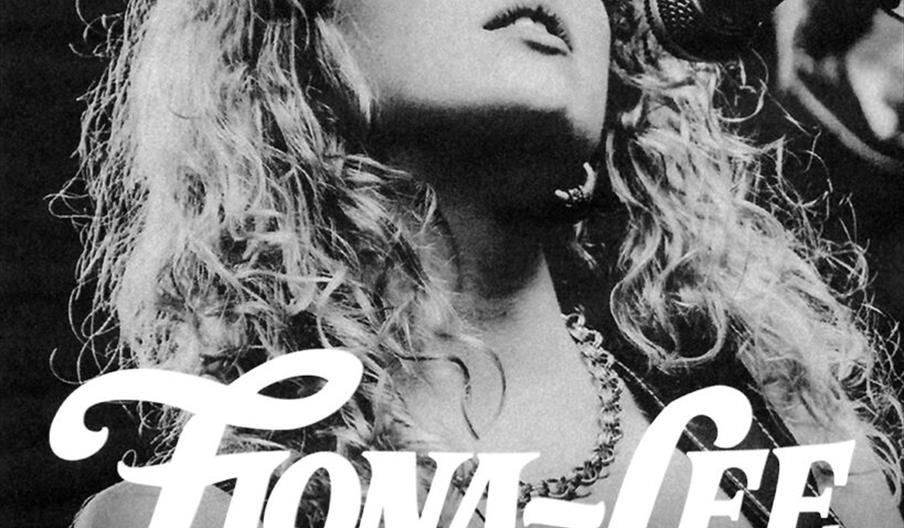 Black and white promotional poster showing a woman with curly hair singing into a microphone. Large text reads "Fiona-Lee LIVE," with details below: "