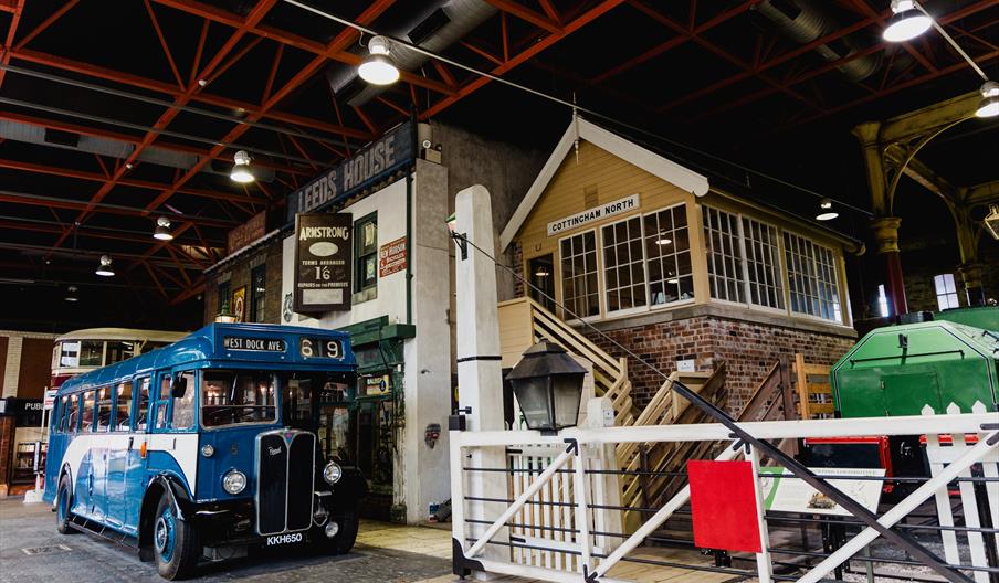 A railway signal box and train in a museum.