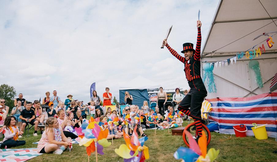 Aman performing circus acts to a audience