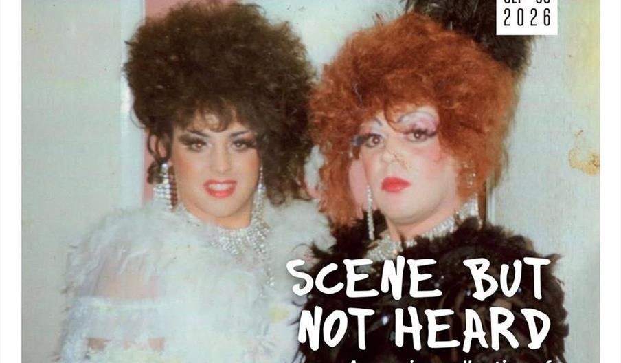 Promotional poster featuring a vintage photo of two drag performers in elaborate wigs and costumes, with event details for an exhibit called "Scene Bu
