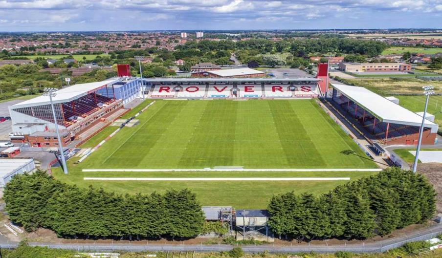 An aerial view of Sewell Group Craven Park in Hull. A large rugby pitch has 3 sides of stands, with one set of seating spelling out 'Rovers' in red.