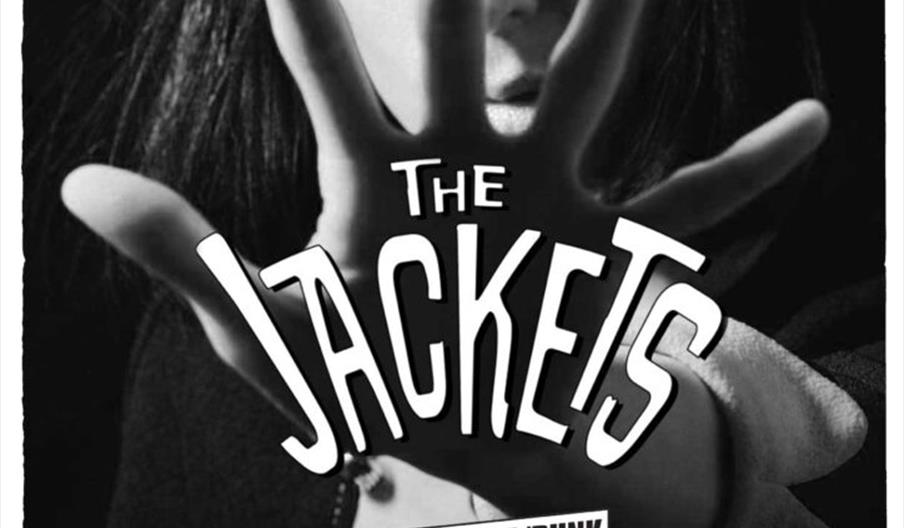 Black and white gig poster for the band "The Jackets" with a photo of a woman with dramatic eye makeup holding her hand in front of her face. The post