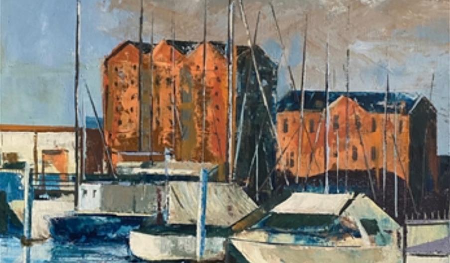 Painting of a marina with several boats docked in the foreground, reflecting on the water, and tall orange brick buildings with small windows in the b