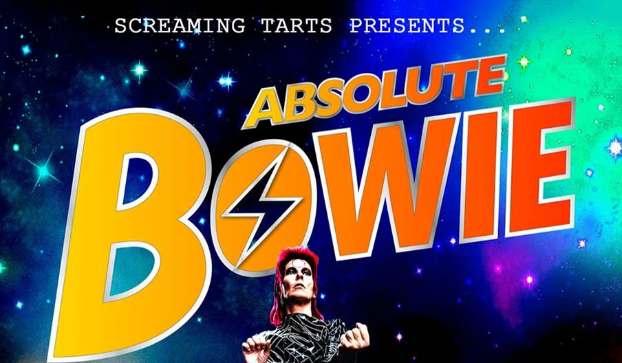 Poster for "Absolute Bowie" with bold yellow and orange text on a star-filled galaxy background, featuring a performer in Ziggy Stardust makeup and co