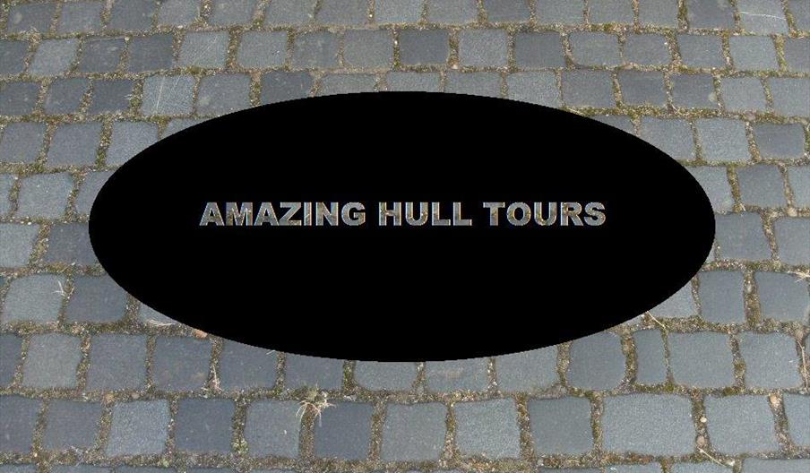 A black circle on a cobbled floor, with the words 'Amazing Hull Tours'