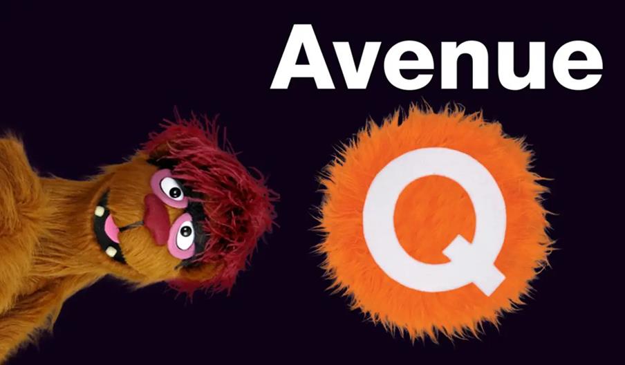 A fuzzy brown puppet with red hair and pink eyelids leans in from the left beside the words "Avenue Q," with the letter "Q" shown as a large orange fu