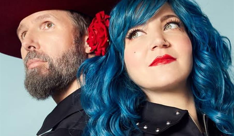 Promotional poster for a concert by "Beaux Gris Gris & The Apocalypse," featuring a man in a wide-brimmed hat with a beard and a woman with bright blu