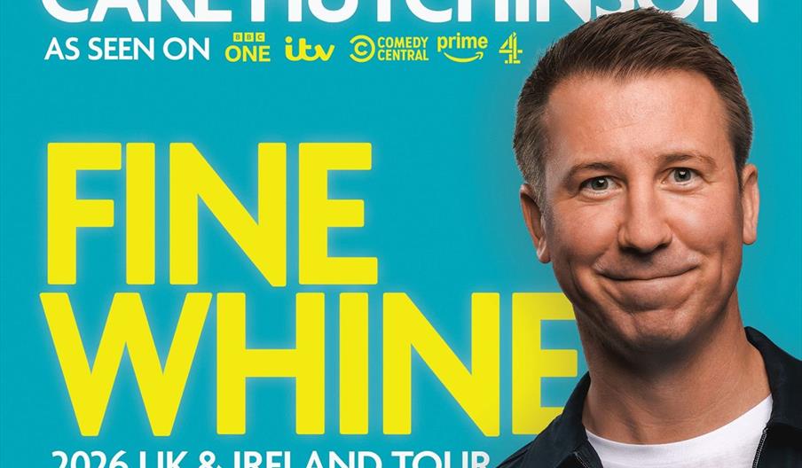 A smiling man stands in front of the words 'Carl Hutchinson: Fine Whine, 2026 UK & Ireland Tour'.
