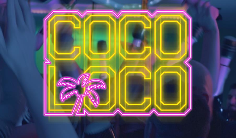 A neon-style sign reading "COCO LOCO" with a pink-outlined yellow font and a pink palm tree graphic overlays a blurred scene of people dancing and rai
