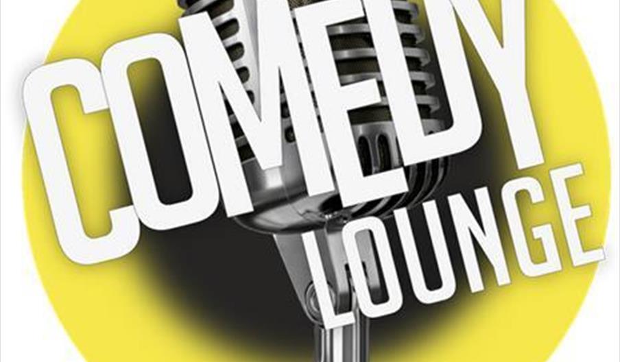 A vintage-style microphone is in front of a yellow circle, with the words "COMEDY LOUNGE" in large, bold letters overlapping the microphone.