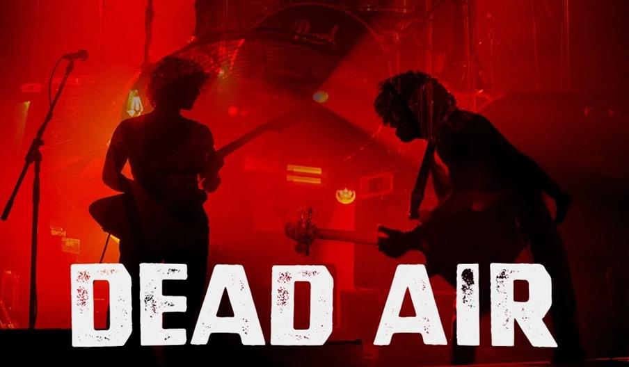 A promotional poster for the band Dead Air's Autumn Tour 2026 features three band members playing on stage in dramatic red lighting, with tour dates a