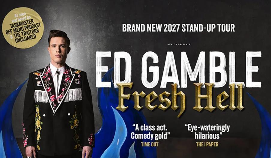 A promotional poster for Ed Gamble's 2027 stand-up tour "Fresh Hell," featuring Ed Gamble in a black suit with floral embroidery and white fringe, sta