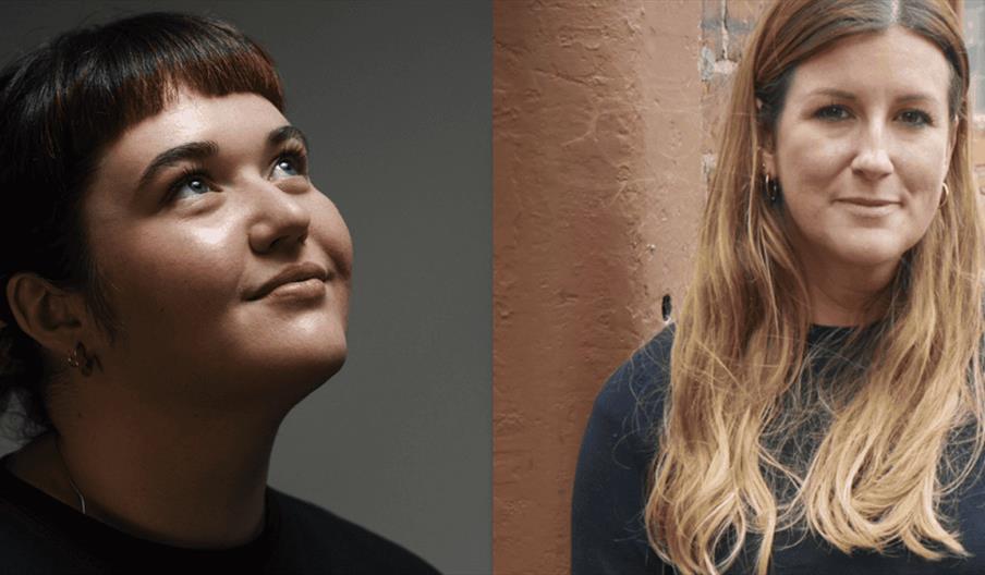 Two women stand in portrait in front of the camera.
