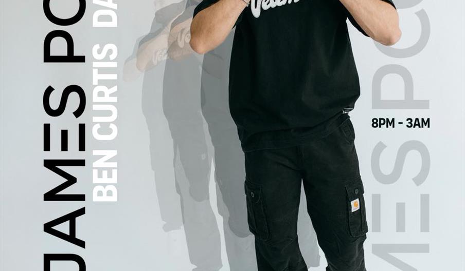 A promotional poster for a music event featuring a man in a black "Vetements" t-shirt and black pants, posing against a white background with a faded