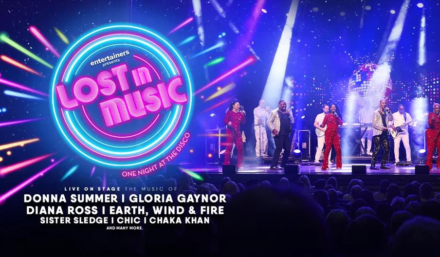 A stage performance with singers and musicians dressed in sparkly outfits under colorful lights, with a neon "Lost in Music" sign on the left and text