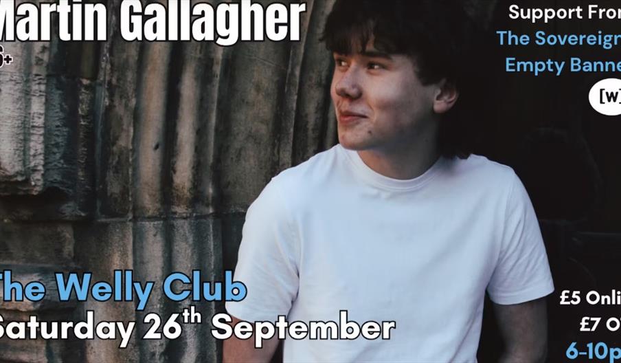 Promotional poster featuring a young man in a white t-shirt standing against a stone wall, with event details for a Martin Gallagher performance at Th