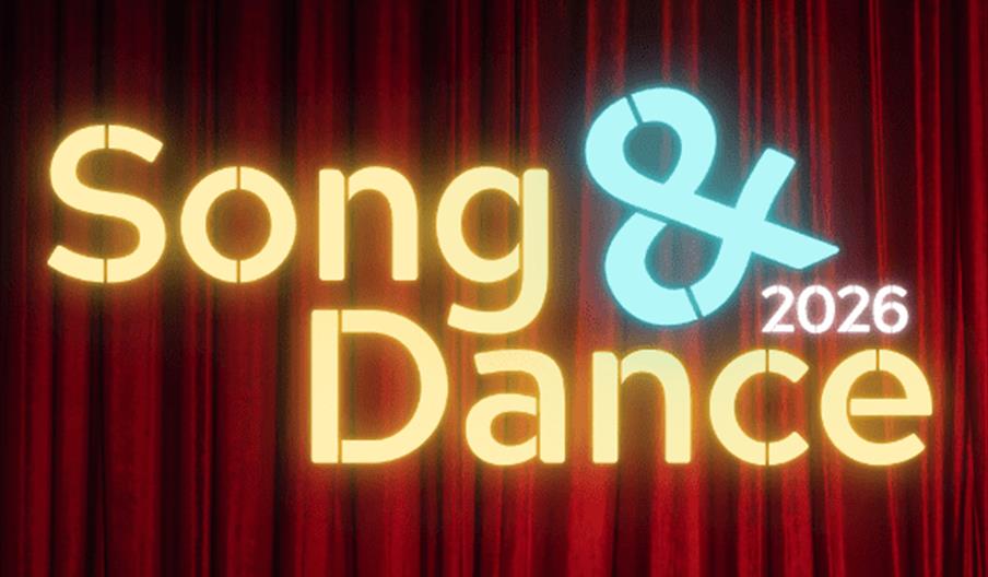 Promotional graphic with red stage curtains in the background and the text "napa Song & Dance 2026" in glowing letters, along with the words "Musical