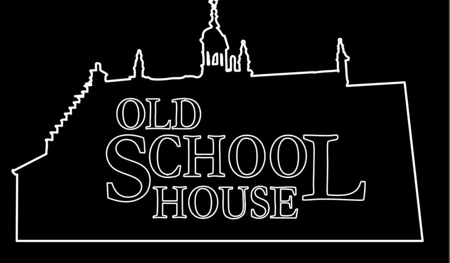 A black background with a white outline in the shape of the venue, with the words 'Old School House' contained inside.