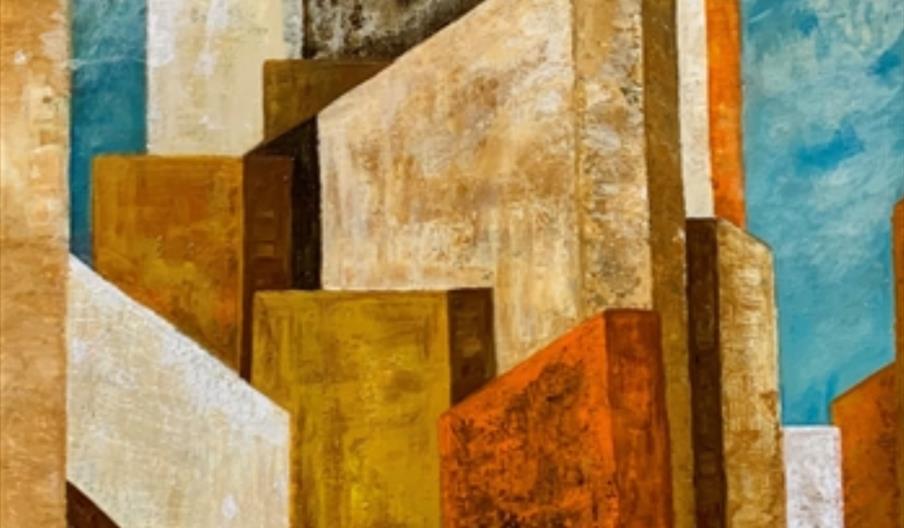 Abstract painting depicting geometric shapes resembling tall buildings in earthy tones of orange, brown, and yellow against a blue sky. The forms over