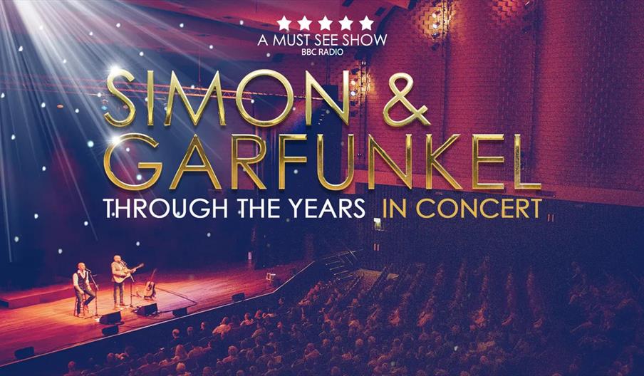 Concert poster with two musicians performing on a stage in front of a large seated audience, overlaid with text: "A must see show BBC Radio. Simon & G