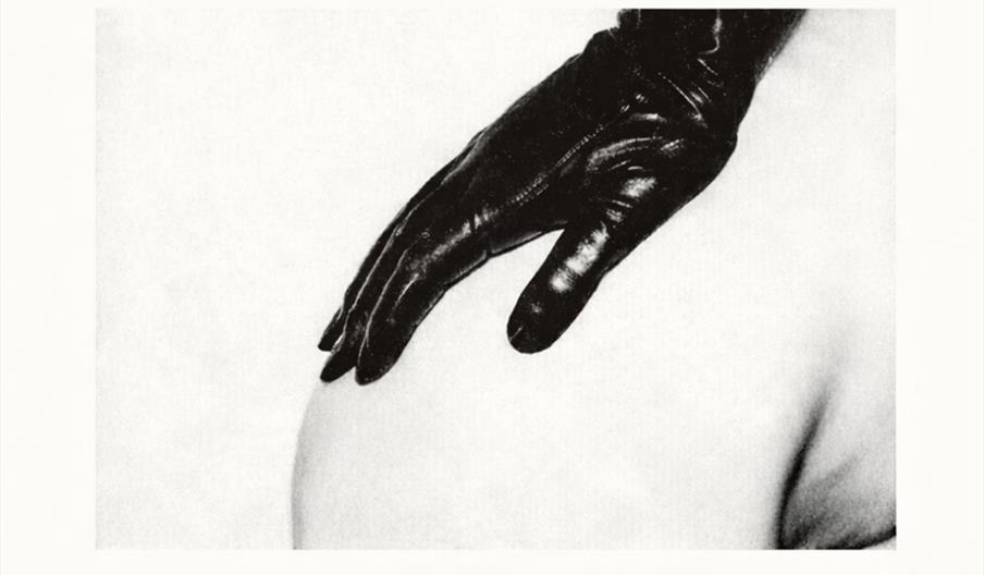 Black and white poster for "The UK Strokes" with large bold text, a photo of a gloved hand resting on a bare hip, and event details: Polar Bear, Hull,