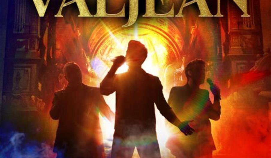 Three male singers are silhouetted against a dramatic, colorful background with beams of light, under large gold text that reads "Voices of Valjean."