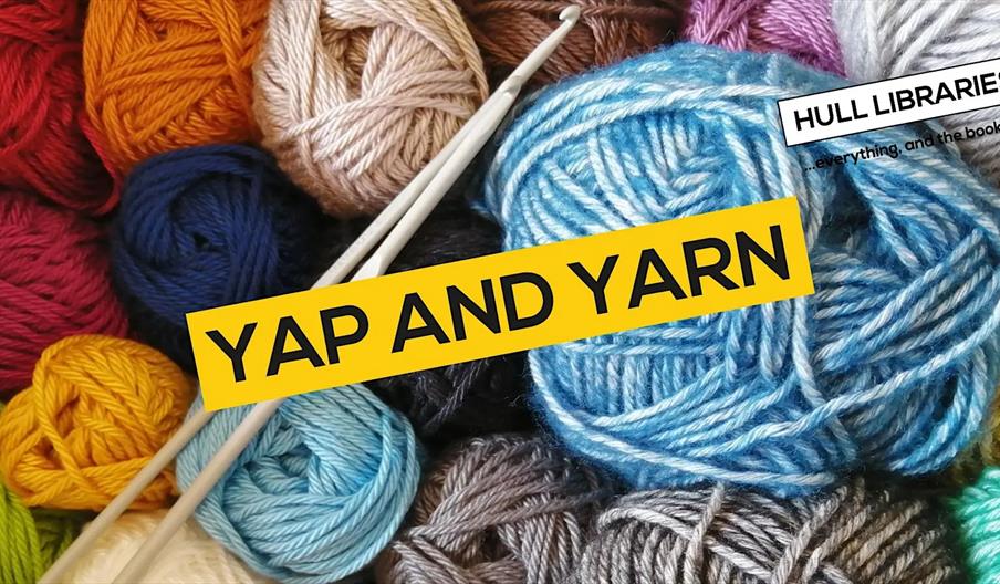 Several colourful balls of yarn and two knitting needles are arranged together, with a yellow banner in the center displaying the text "Yap and Yarn."