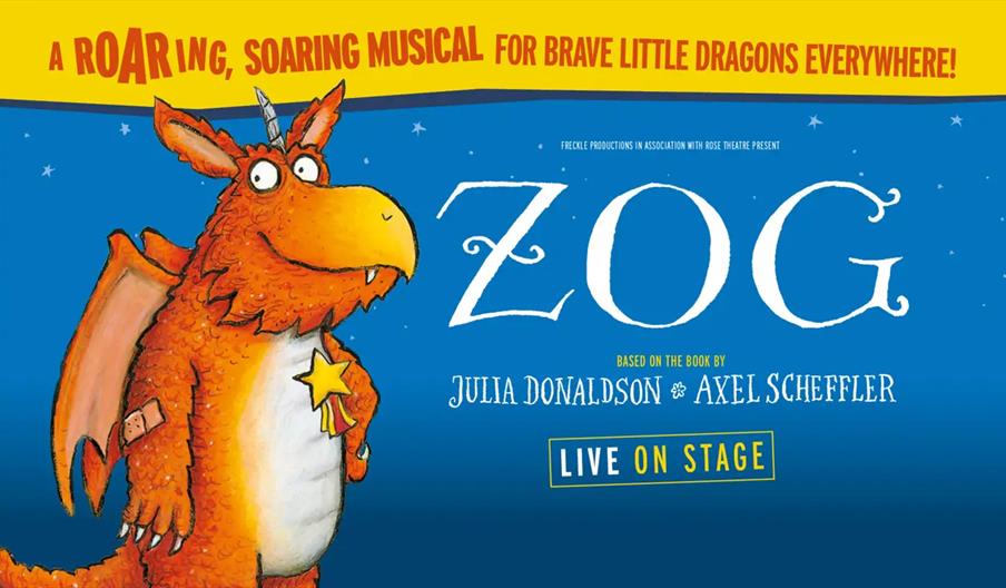 Illustration of an orange dragon with a star-shaped medal around its neck stands on the left, with text promoting "Zog," a musical based on the book b