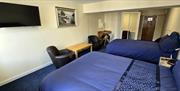 Double bedroom with navy blue bedding.