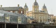 Hull Maritime Museum and Princes Quay bridge with historic domed architecture beside the waterfront